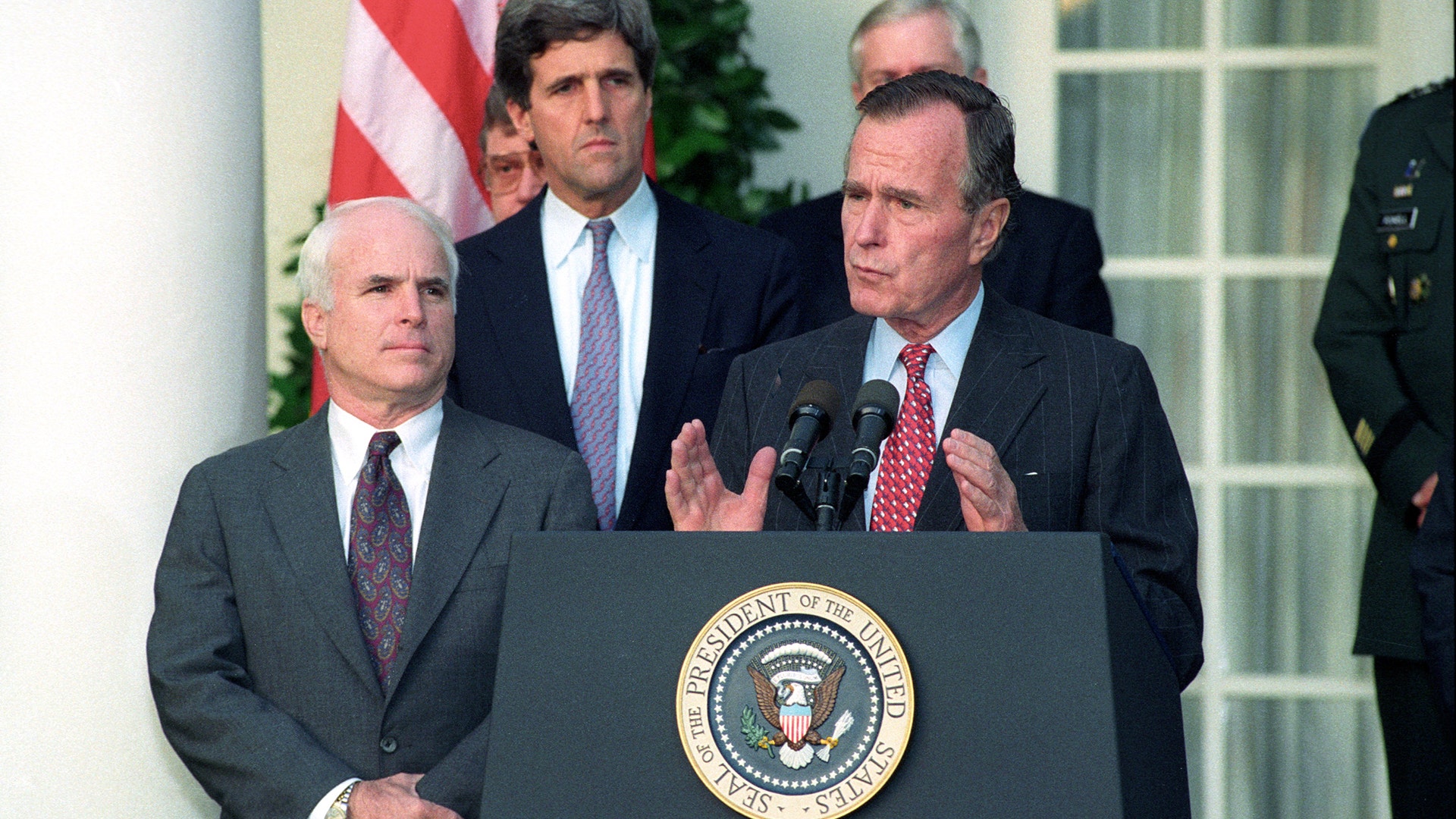 President George Bush addresses reporters at the White House, with Senator John McCain and Senator John Kerry, October 23, 1992 