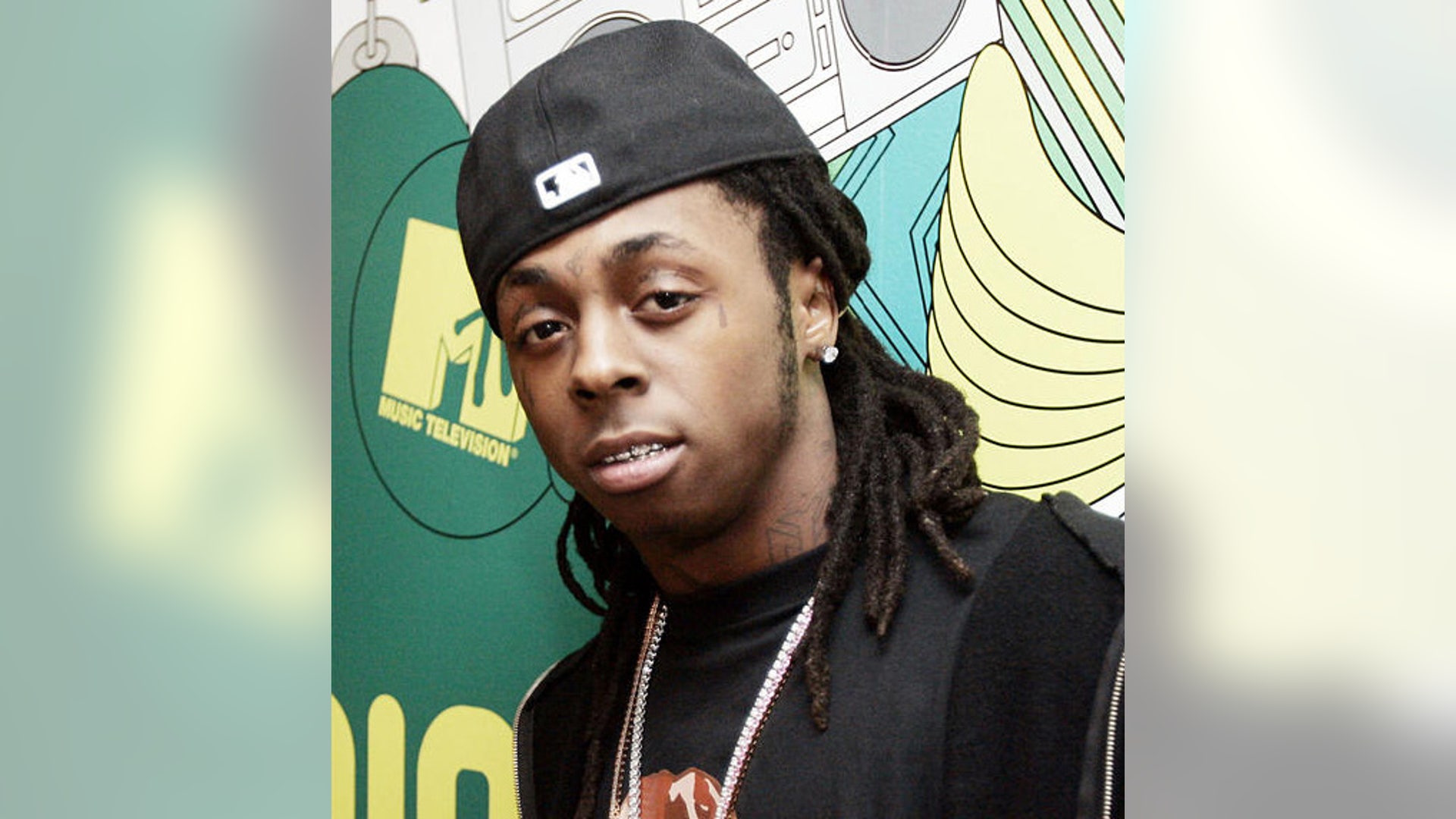 Rapper Lil' Wayne appears backstage during MTV's 'Total Request Live' show at the MTV Times Square Studios in New York in this 2006 file photo.
