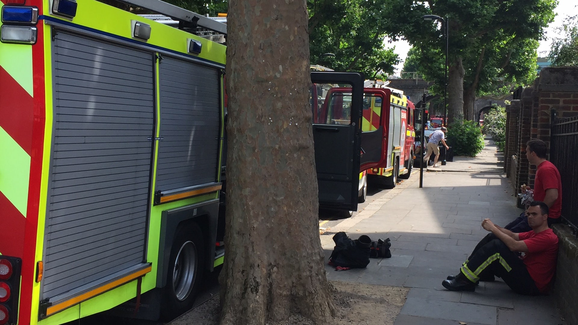 Police, firemen and emergency vehicles still fill the streets a week after the London fire