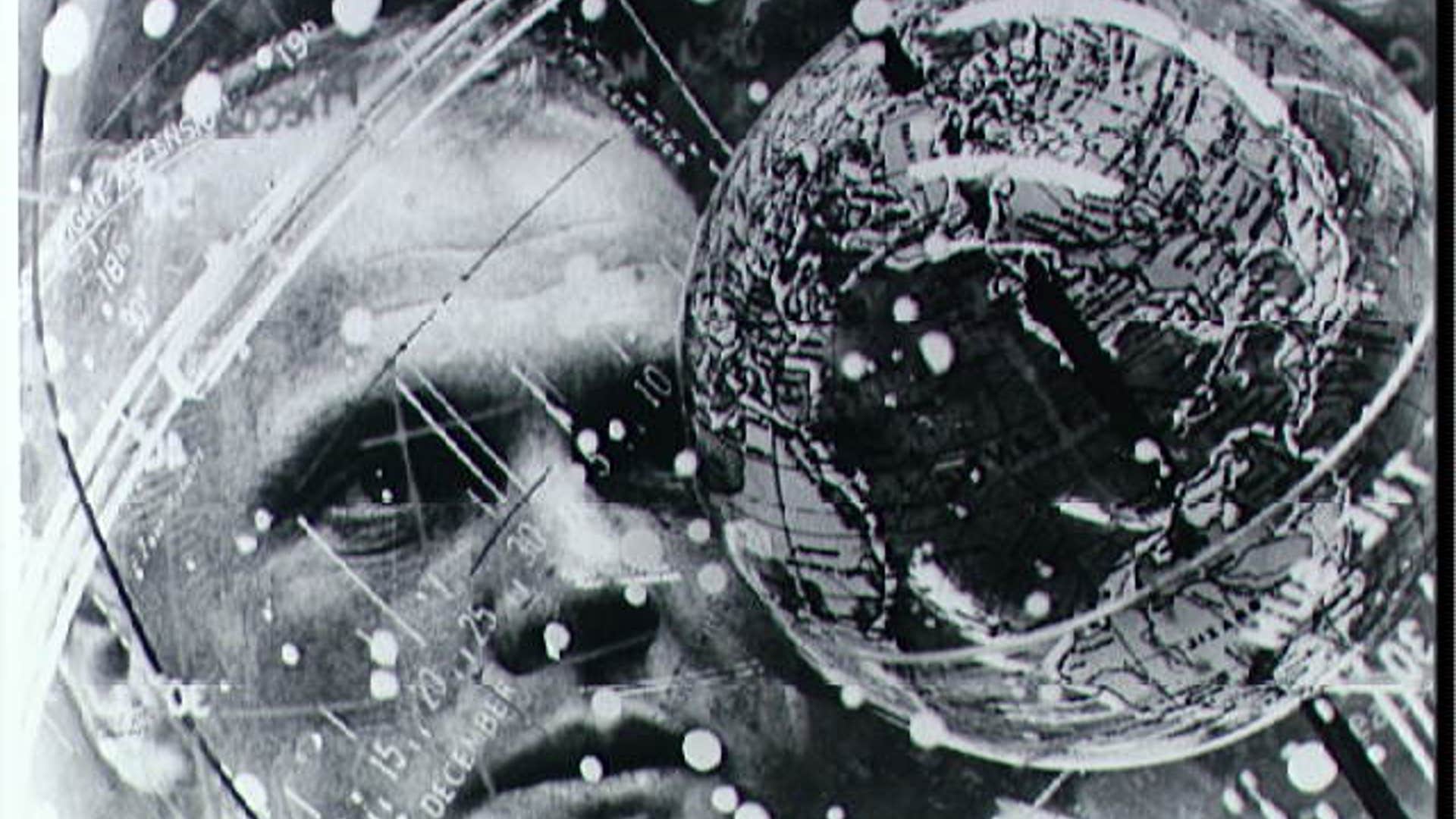 Glenn looking at globe