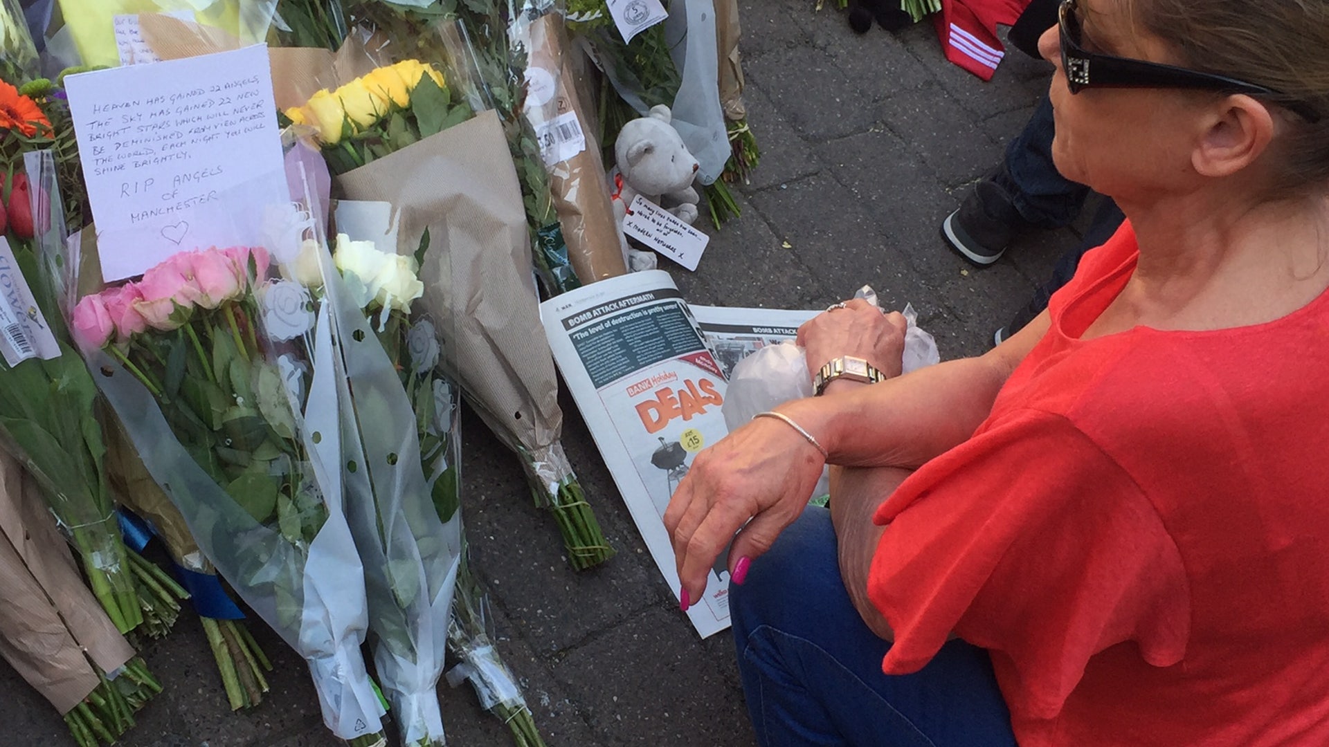 Flower tributes at St. Ann's square in central Manchester, England