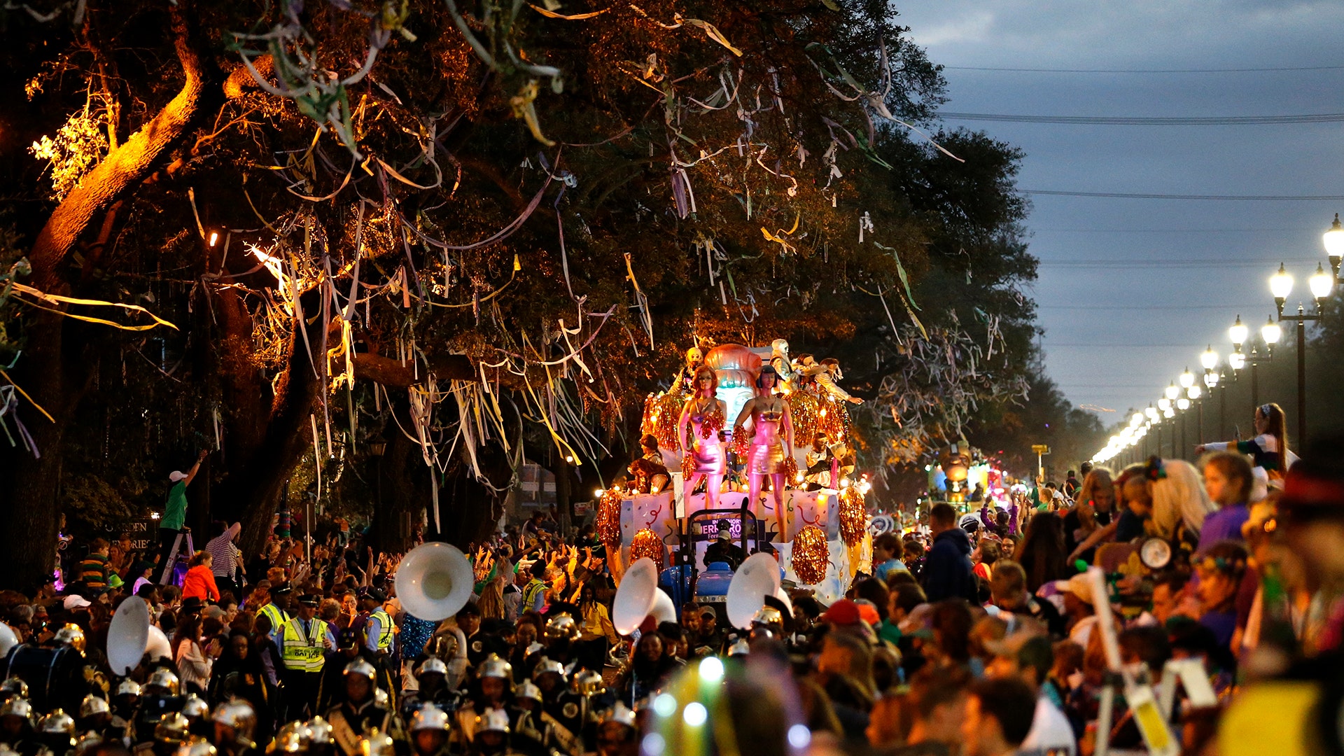 A float follows a marching band during the Krewe of Bacchus Mardi Gras parade in New Orleans.