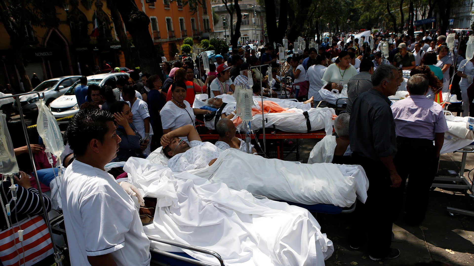 Patients lie on their hospital beds after being evacuated 