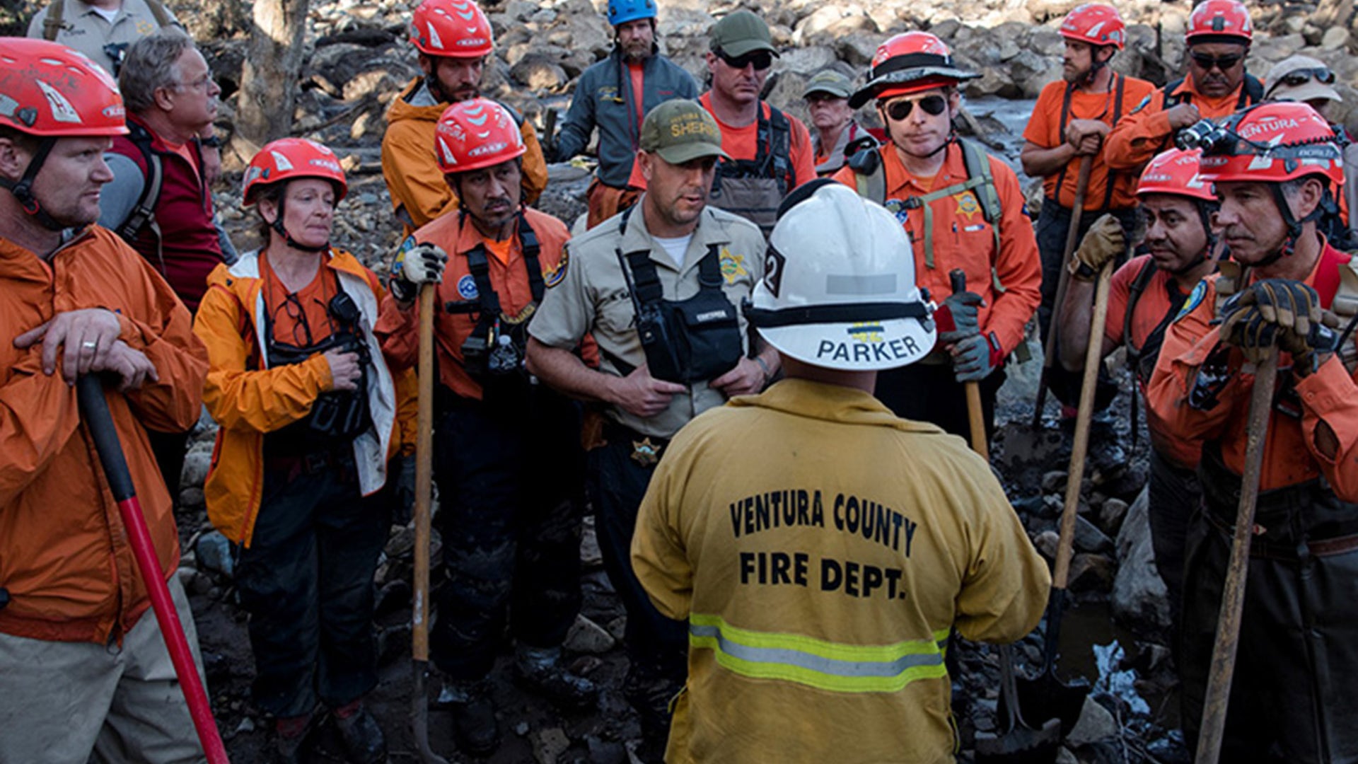 Searchers from around the state continue to dig through the mud and wreckage left by the flash flooding
