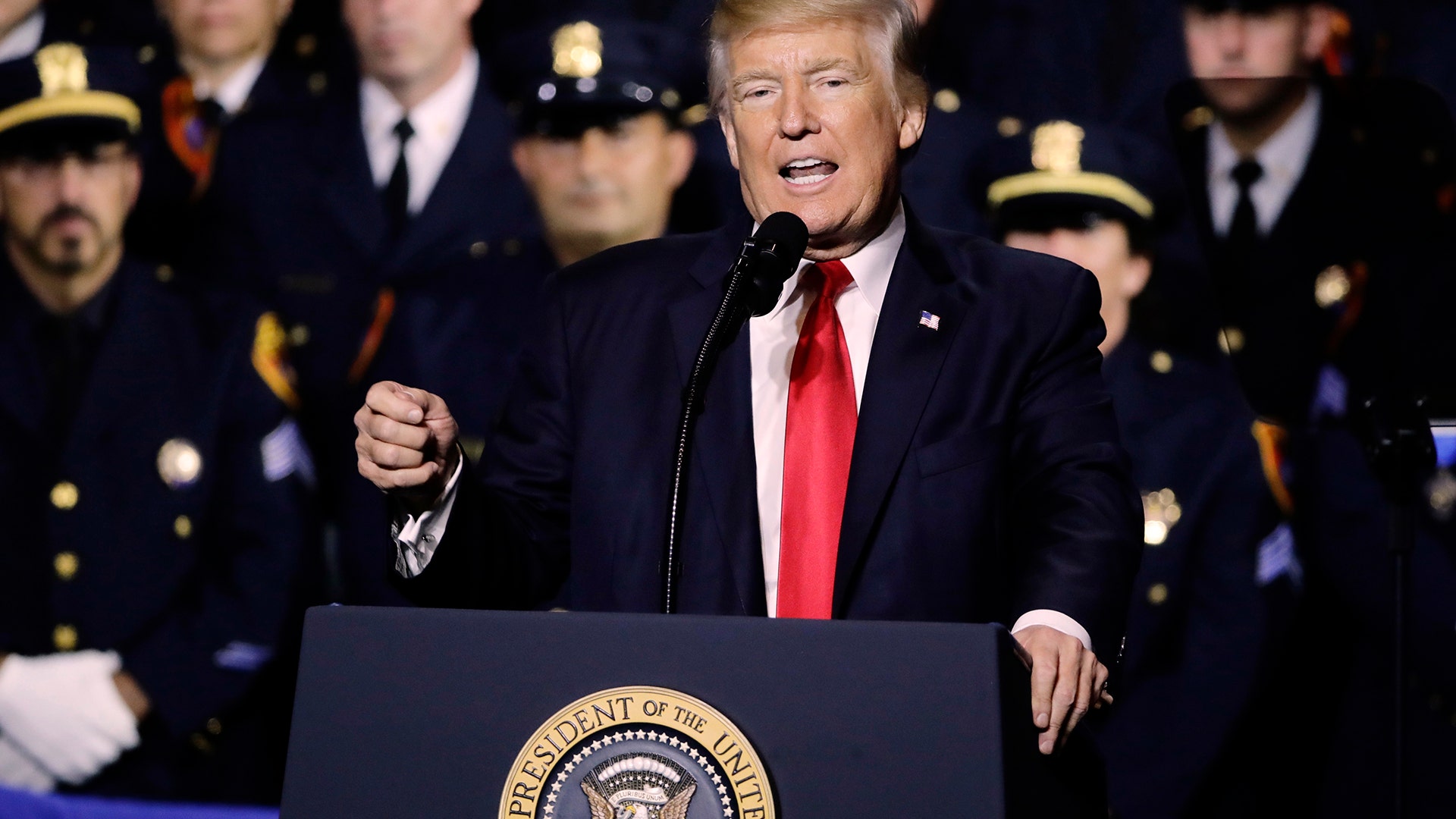 President Donald Trump speaks to law enforcement officials on the street gang MS-13  in Brentwood, N.Y.