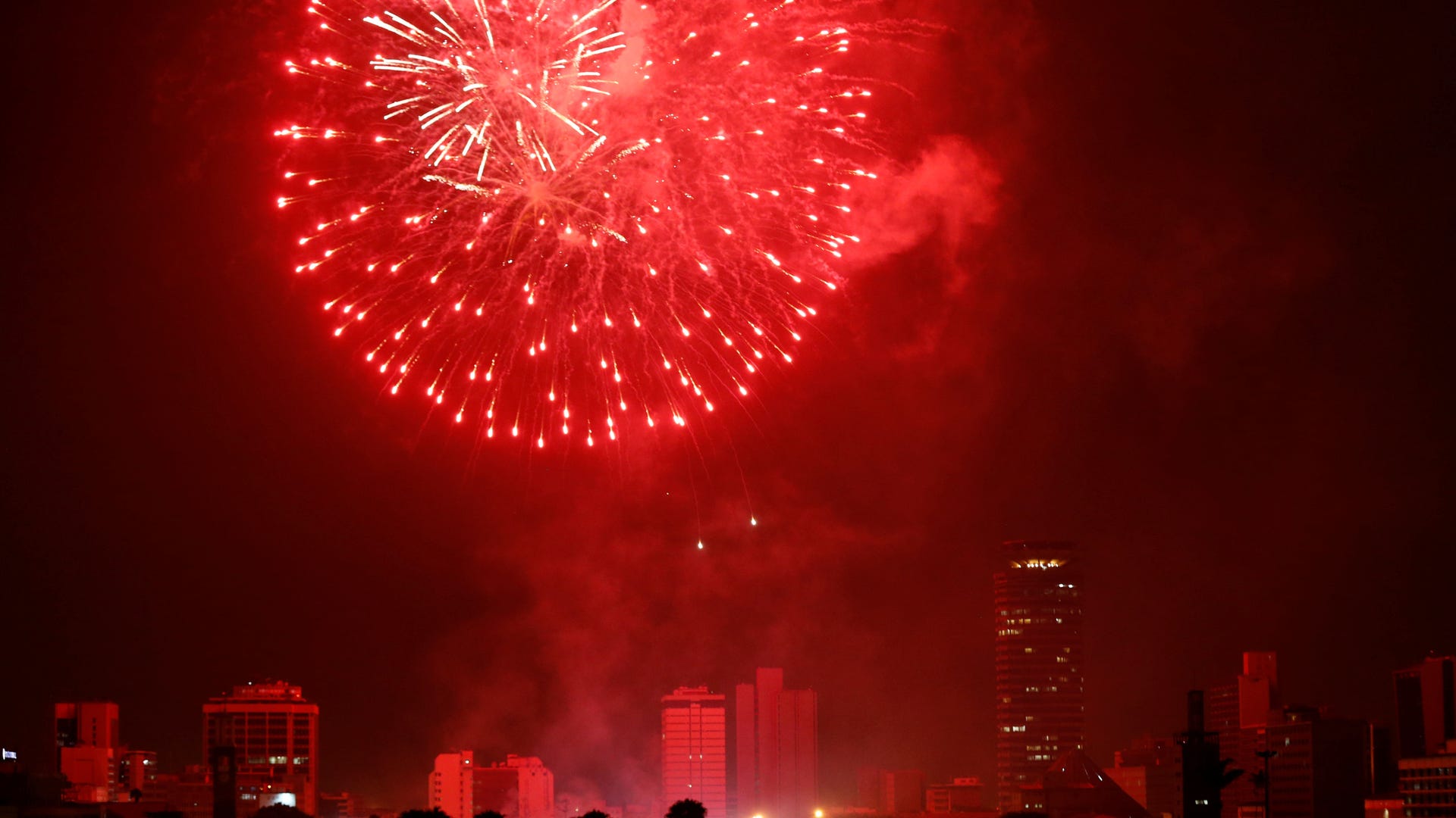 Fireworks explode over the Kenyatta International Convention Centre (KICC) square during the New Year's Eve celebrations in Nairobi, Kenya