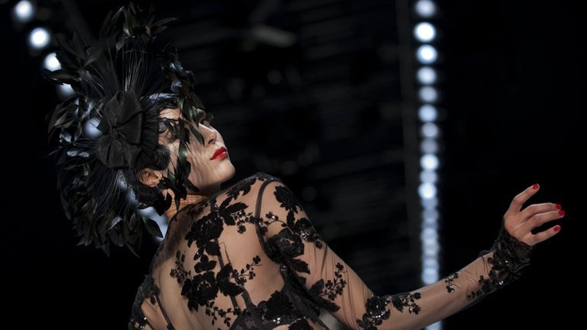 A model displays fashion of the label "Guido Maria Kretschmer" during a Spring/Summer 2014 show of the Mercedes-Benz Fashion Week on July 3, 2013 in Berlin.