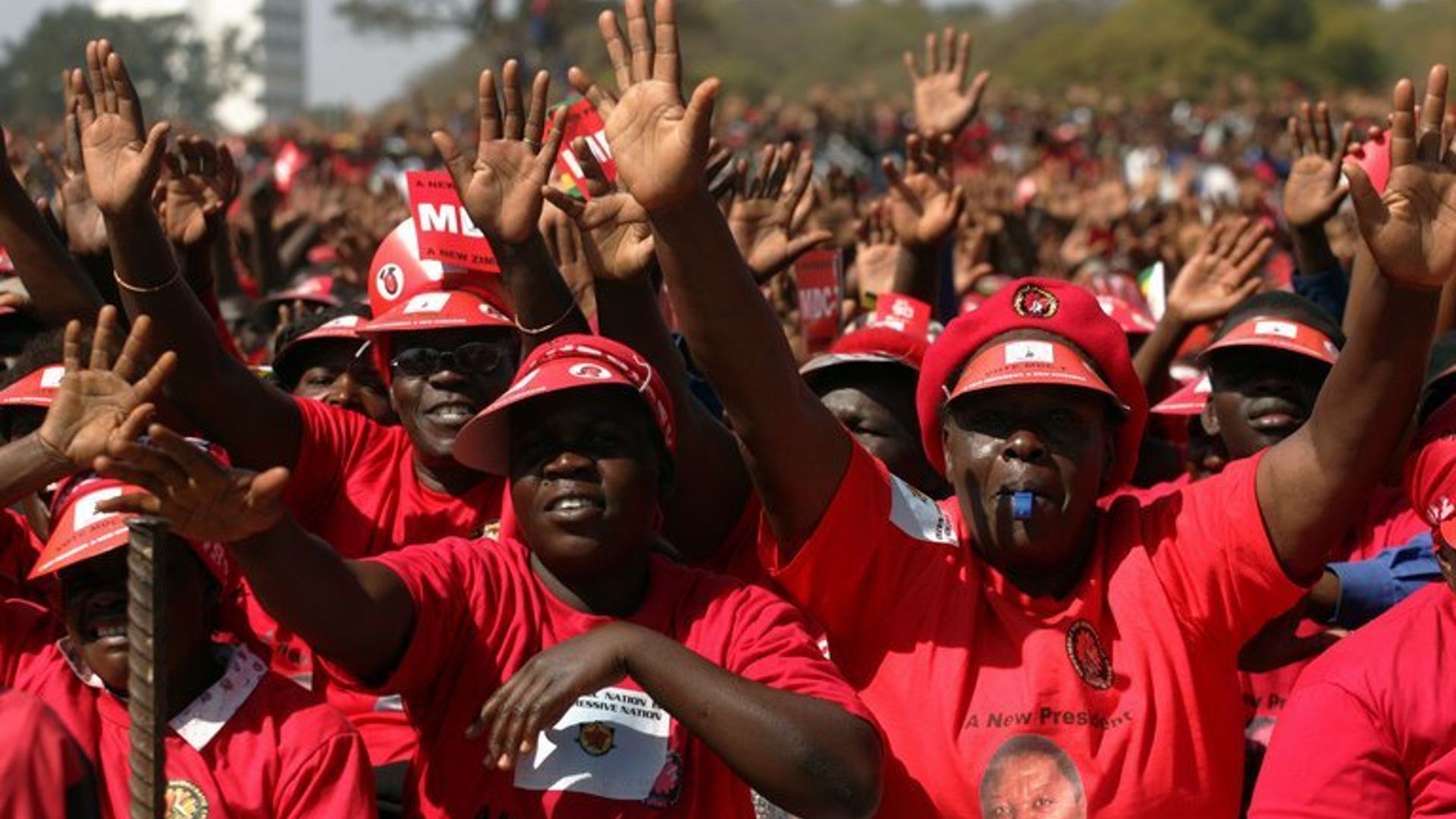 Supporters of the Movement for Democratic Change presidential candidate Morgan Tsvangirai attend the final campaign rally "Cross Over" on July 29, 2013 at the "Freedom Square" in Harare ahead of the general elections held on July 31, 2013.