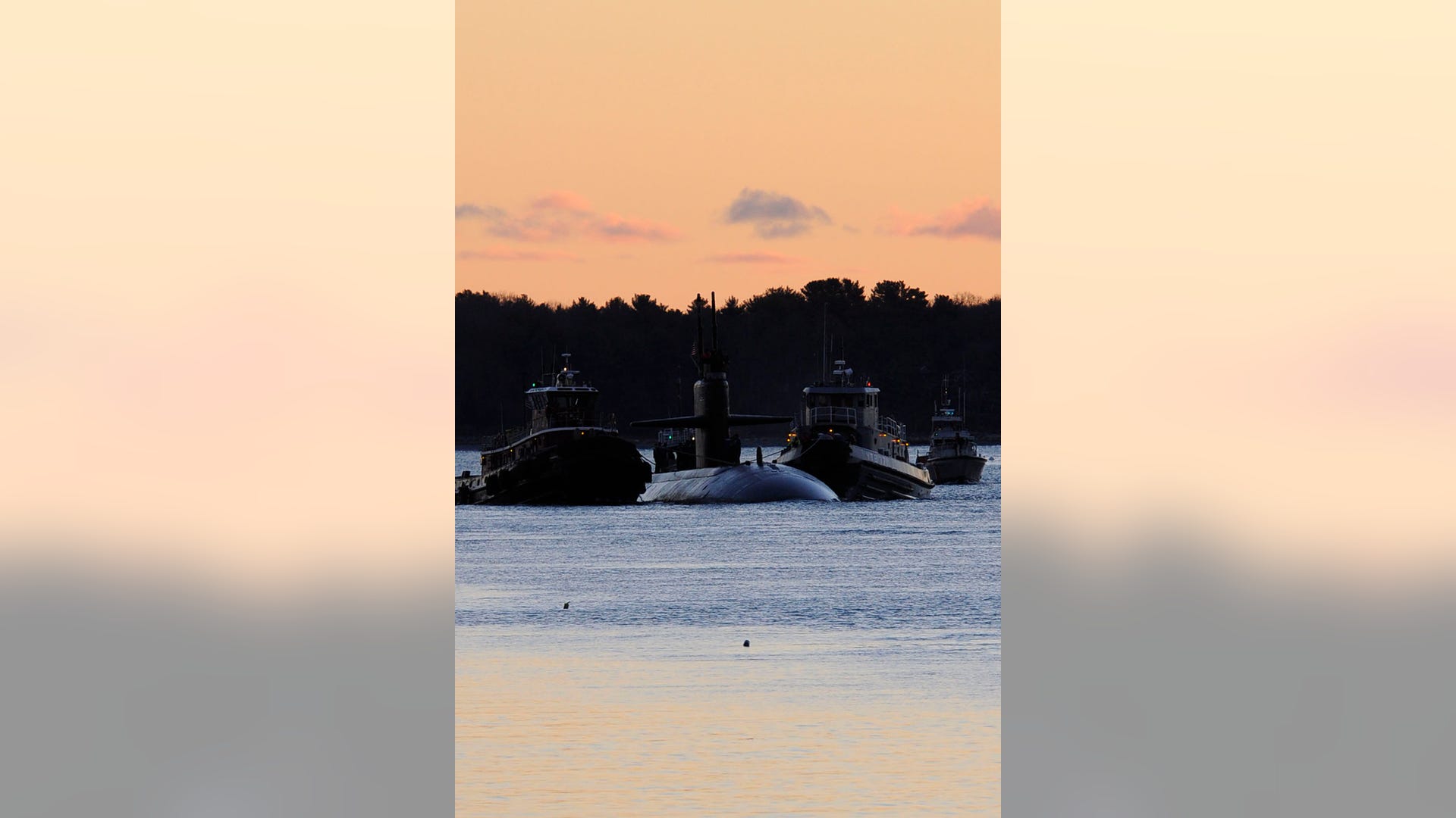 USS Providence, a Los Angeles-class attack submarine arrives at the Portsmouth Naval Shipyard for maintenance