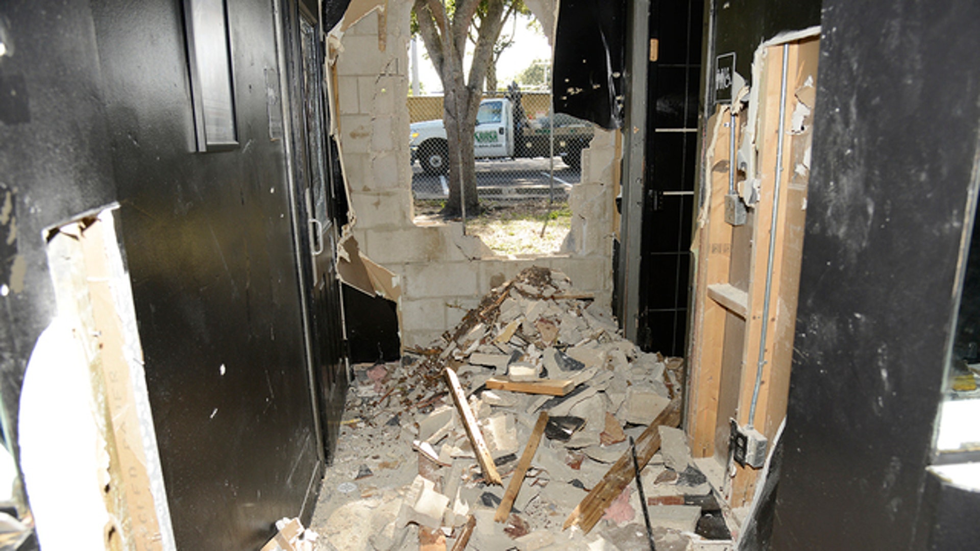 Rubble from the blast where police made their way in.