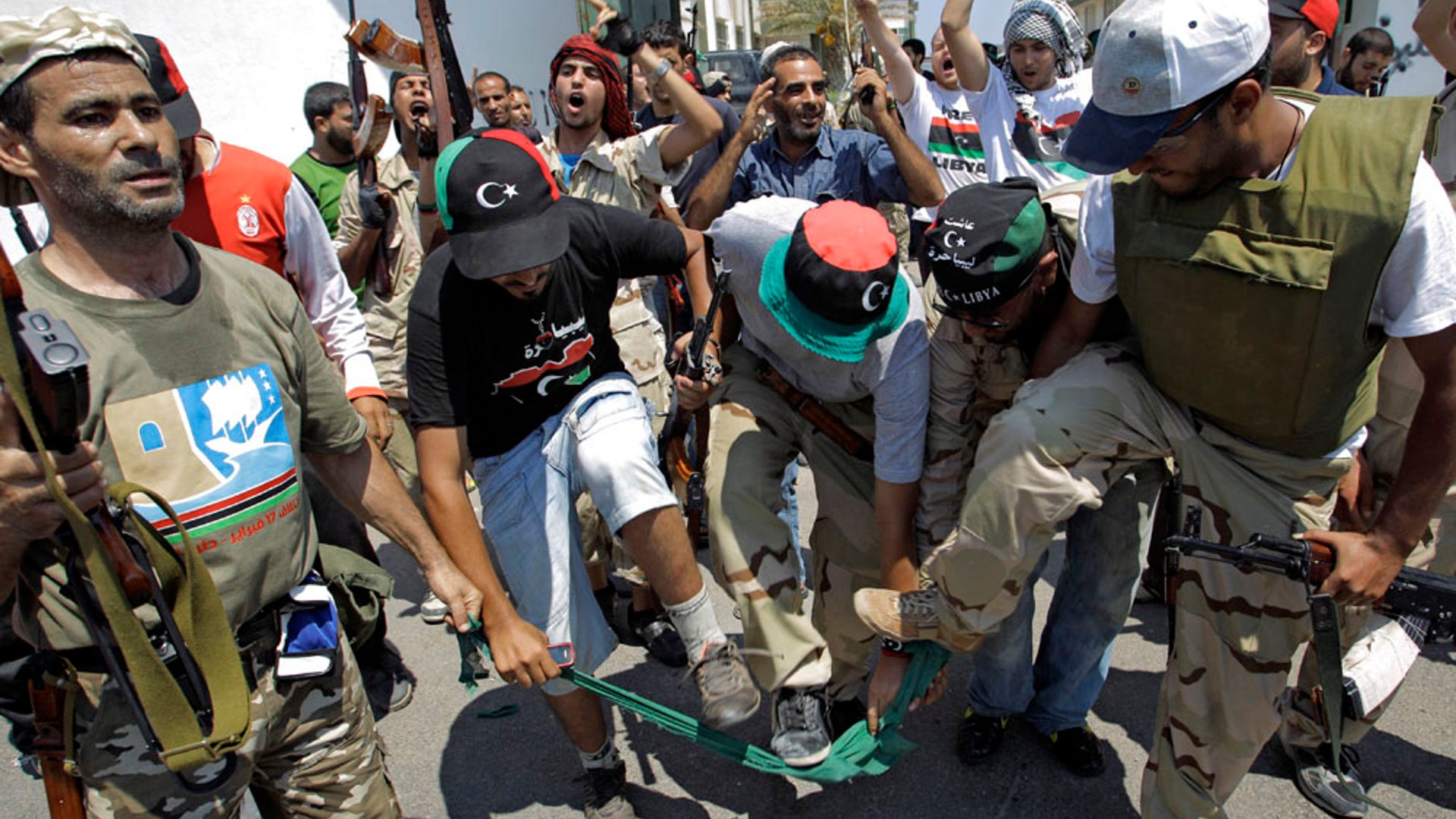 rebel_fighters_tear_flag_AP