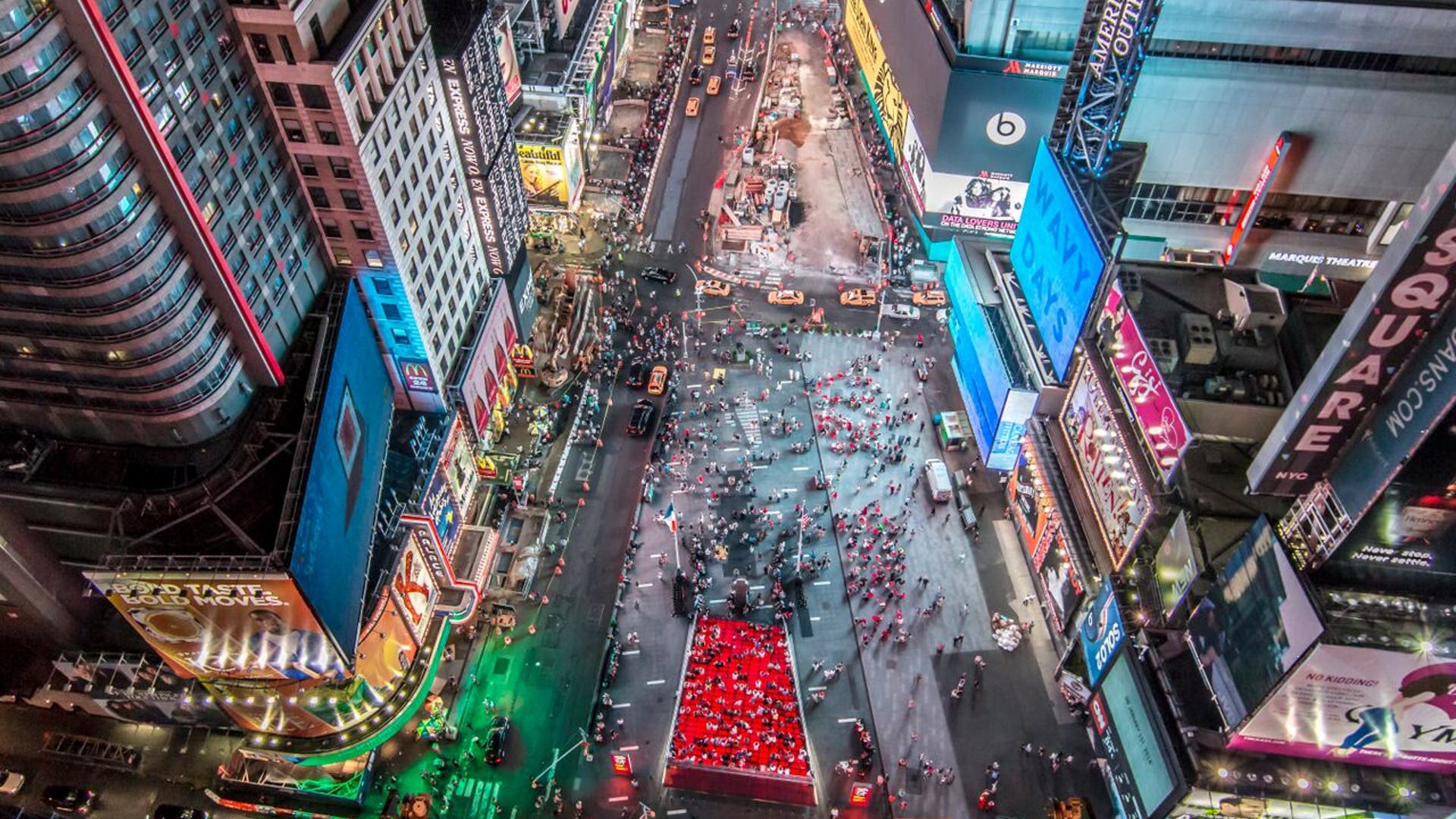 Tourists flock to TKTS below.