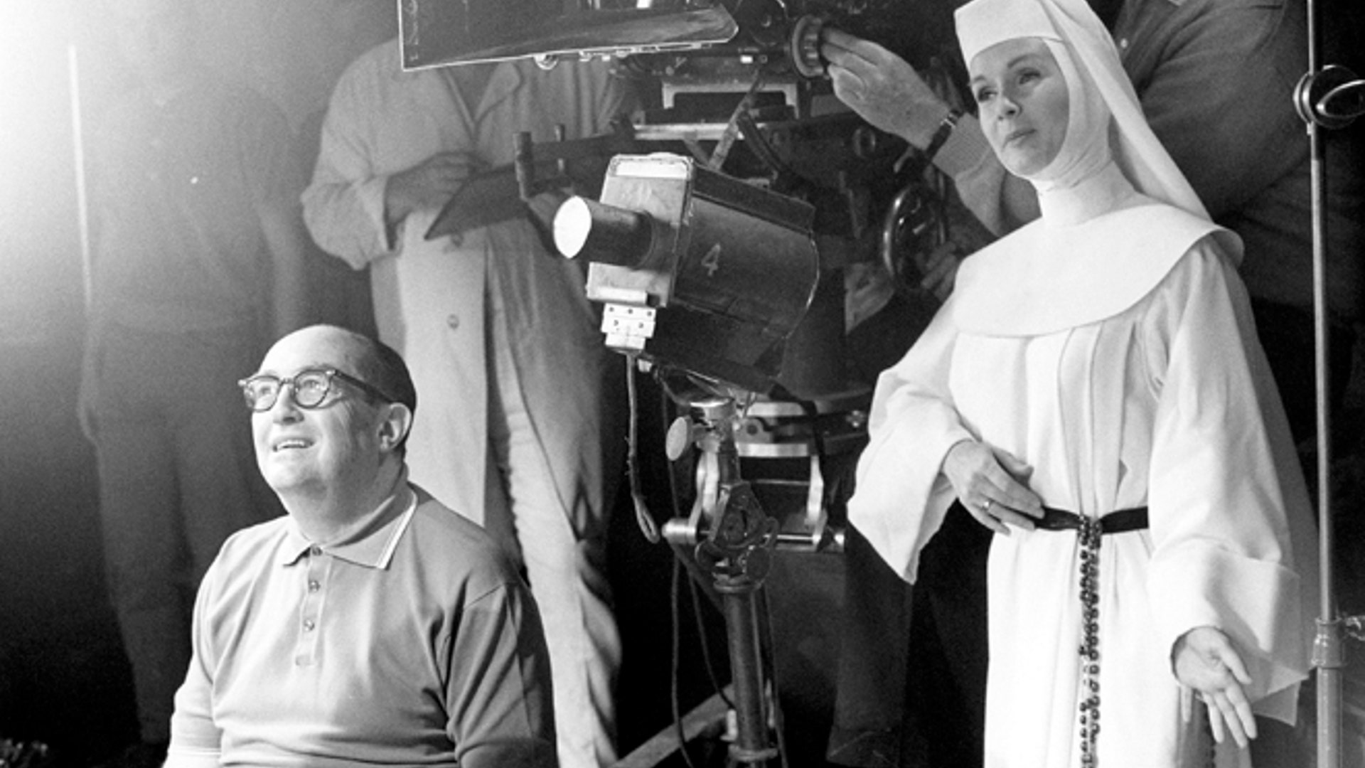 Nov. 15, 1965: Debbie Reynolds, dressed as nun for her role as a singing nun in the MGM picture of that name, practices her next scene while she watches a scene being filmed. 