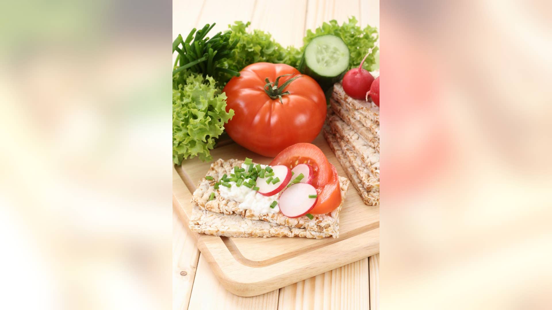 Rice cake with cheese spread and cucumber slices