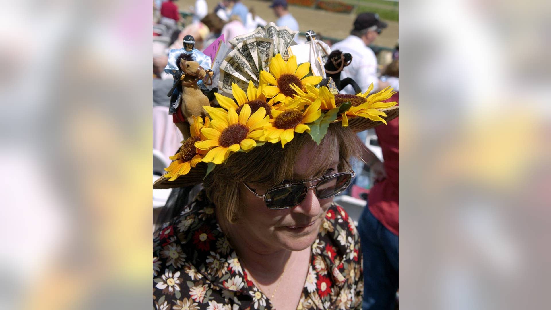 Woman wears sunflower hat at Kentucky Derby
