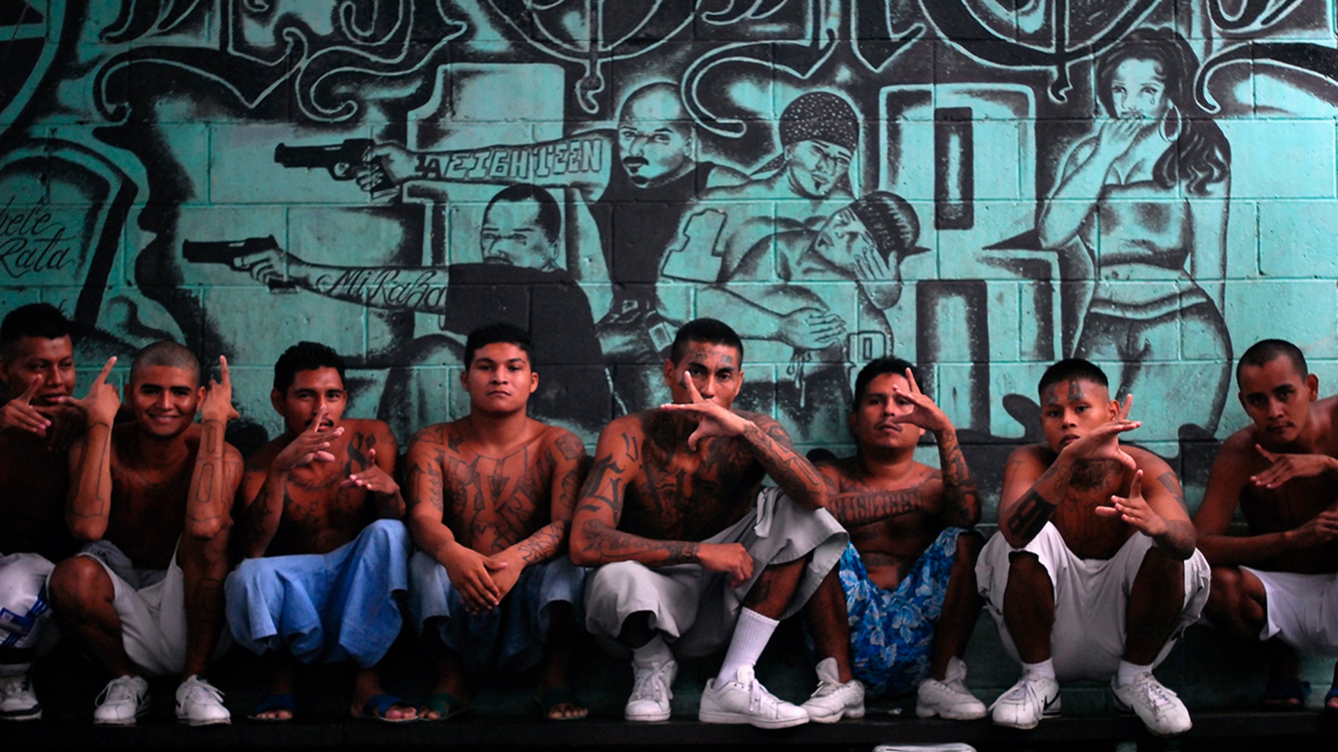 Gang members who are also inmates pose for a photograph at a prison in Quezaltepeque