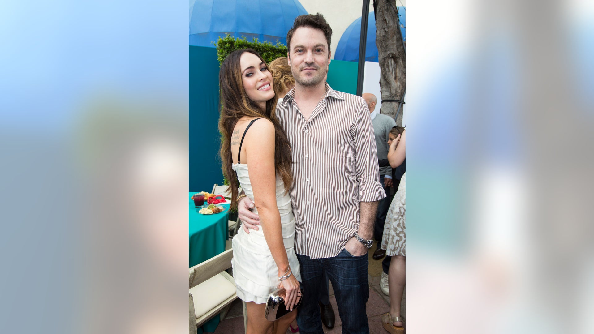 Cast member Megan Fox poses with her husband Brian Austin Green at a block party following the premiere of 