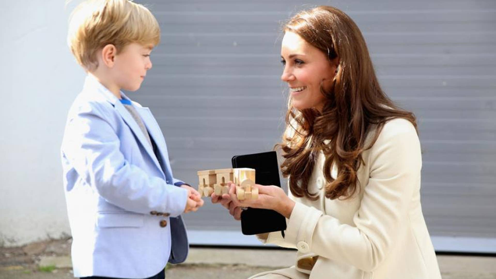 presented with a train for Prince George by actor Oliver Barker