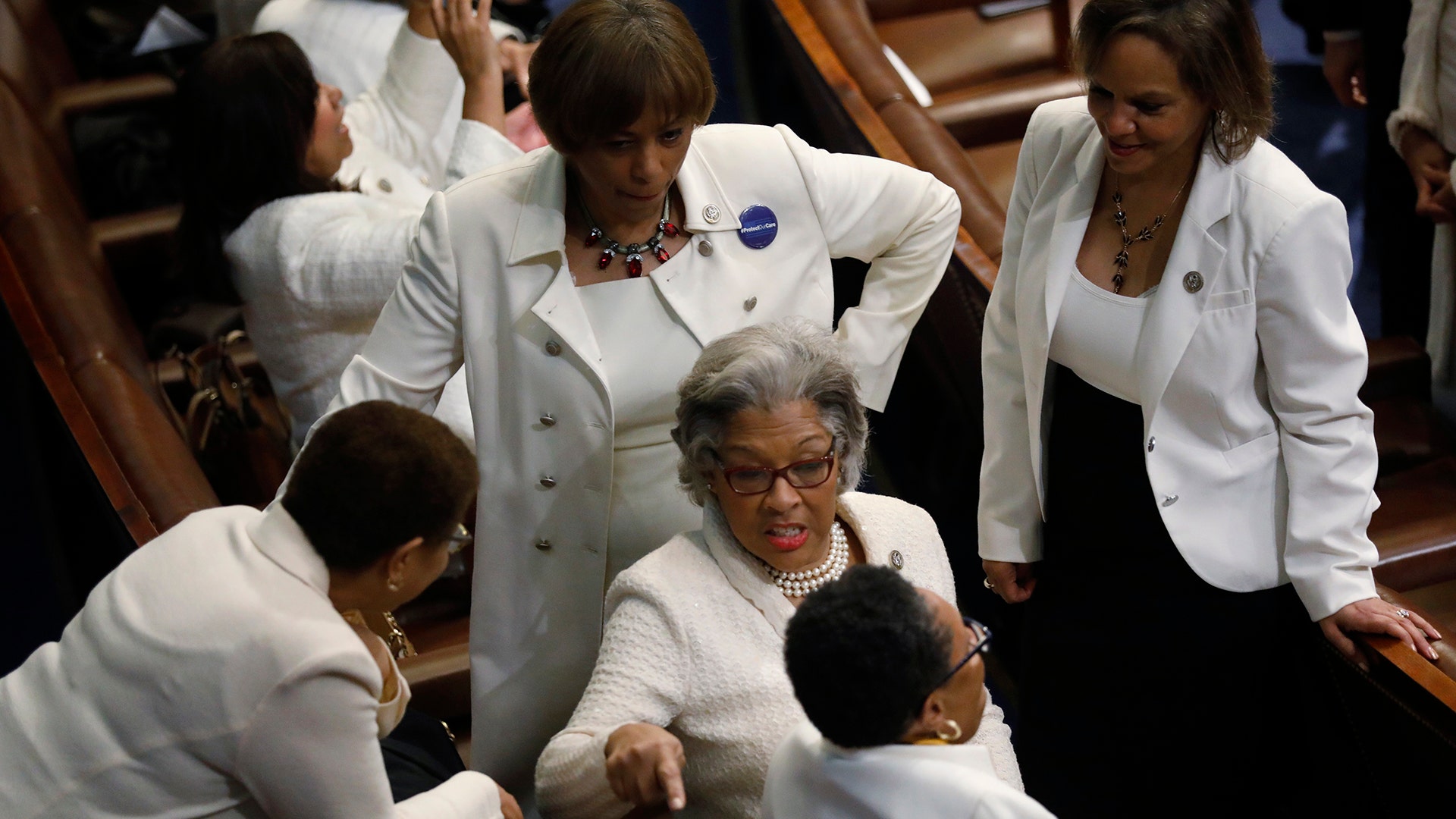 Democratic female members of the House of Representatives talk before U.S. President Donald Trump addresses Congress. 