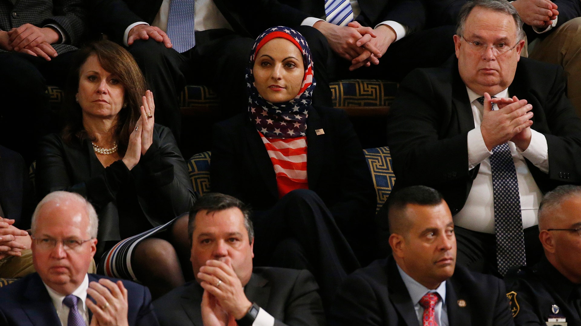 An audience member wears an American flag hijab.