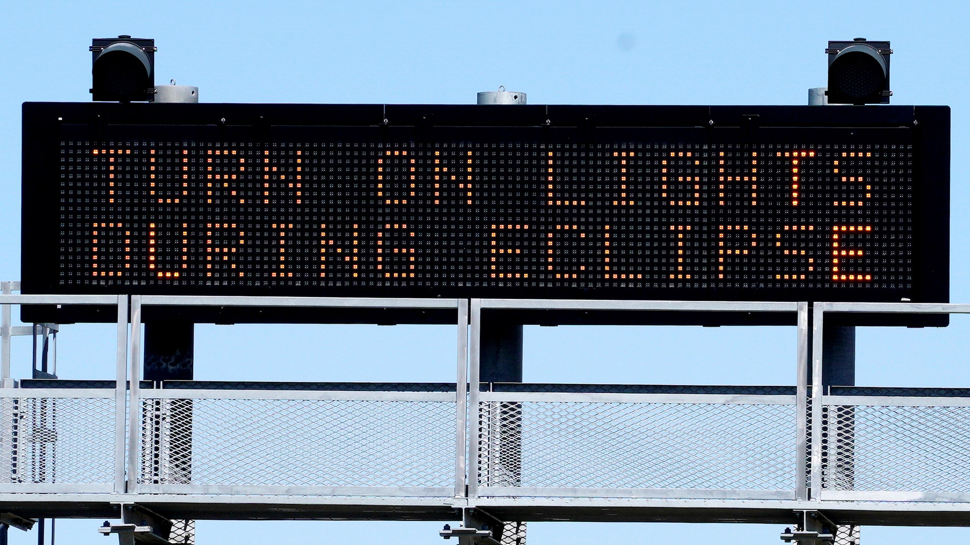 A sign on the highway refers to the upcoming solar eclipse near Guernsey, Wyoming, August 19
