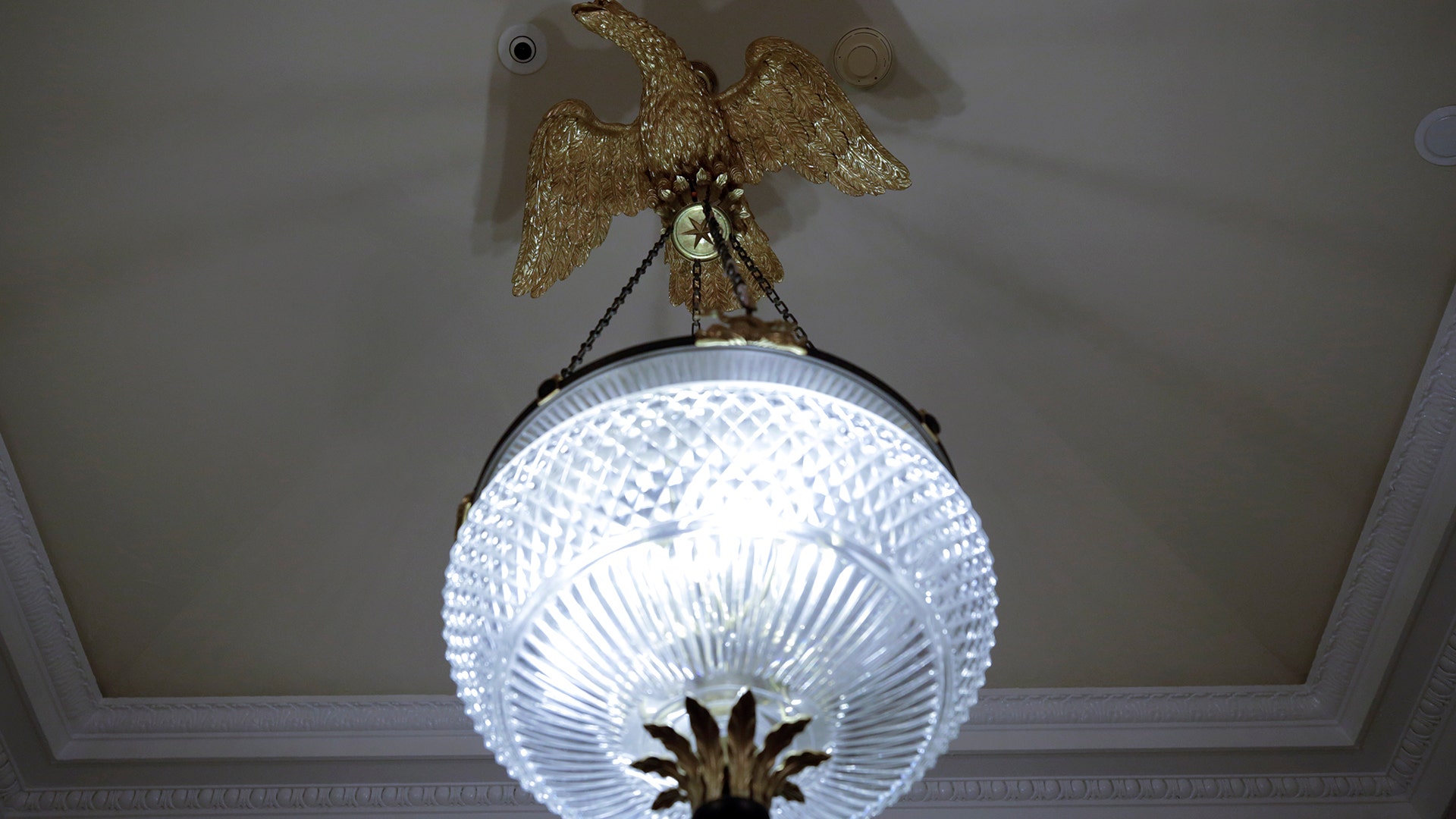 A chandelier is seen outside the Oval Office of the White House after a renovation in Washington