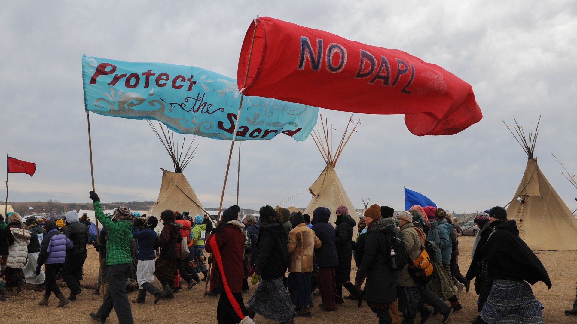 People march in Oceti Sakowin camp.