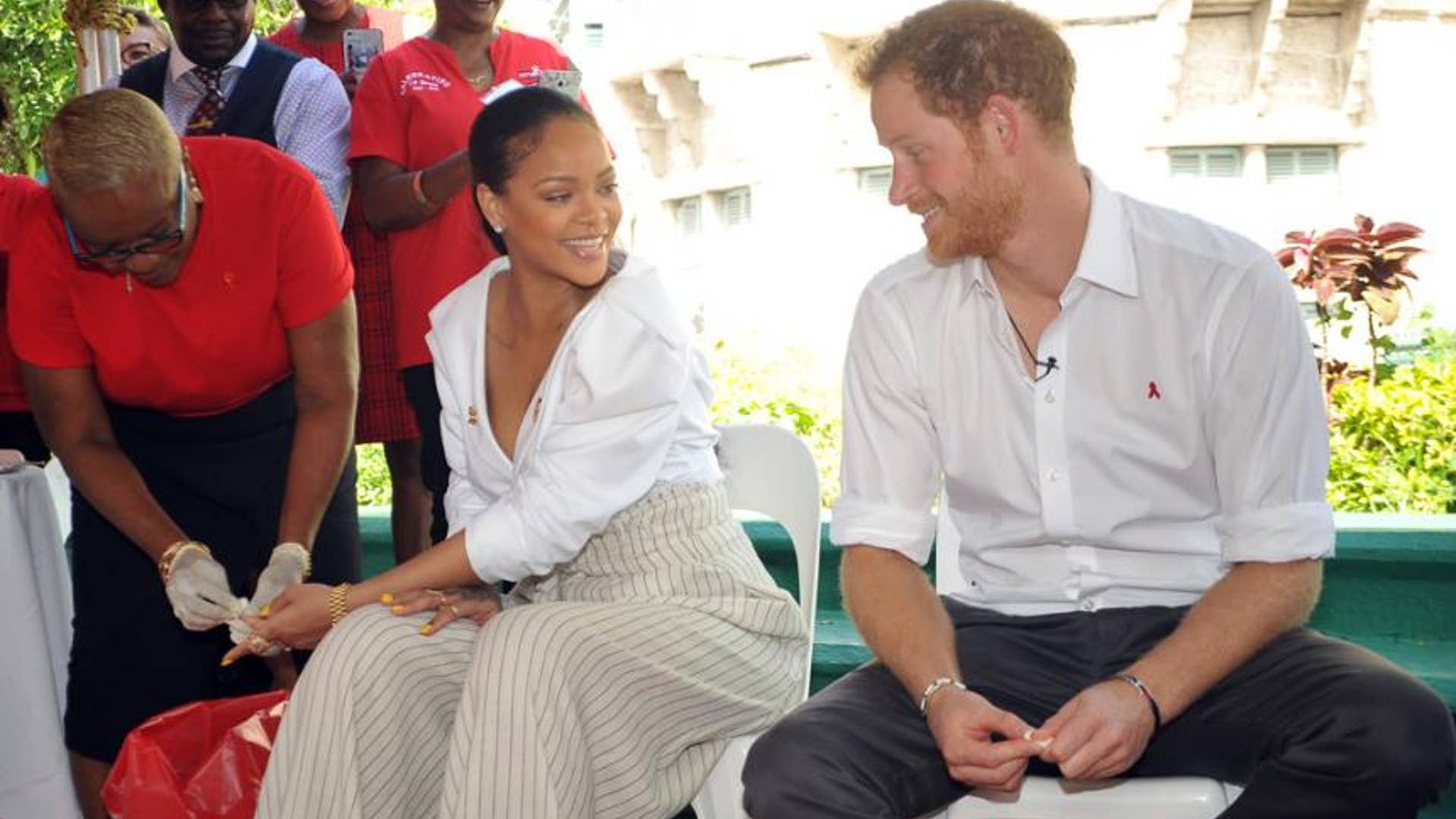 Prince Harry keeps a watchful eye.