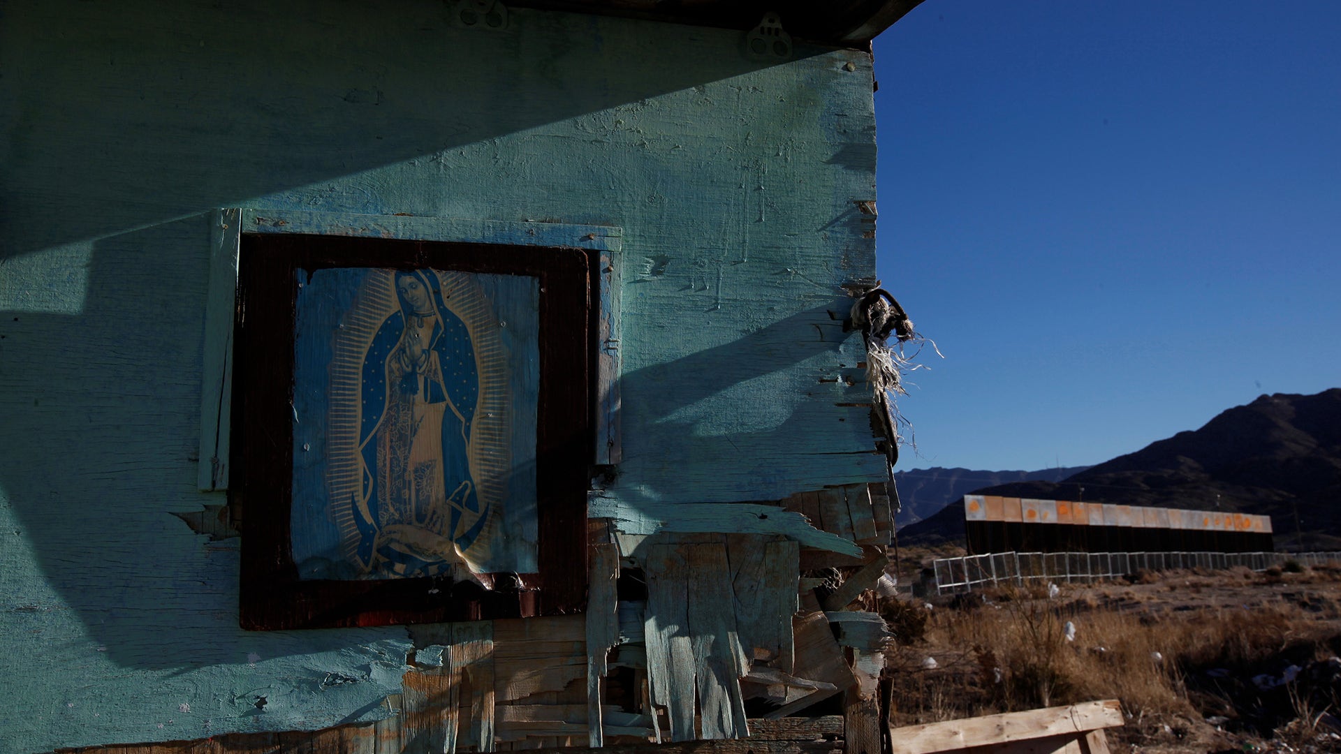 Our Lady of Guadalupe at a house near a newly built section of the U.S.-Mexico border fence in Ciudad Juarez, Mexico.