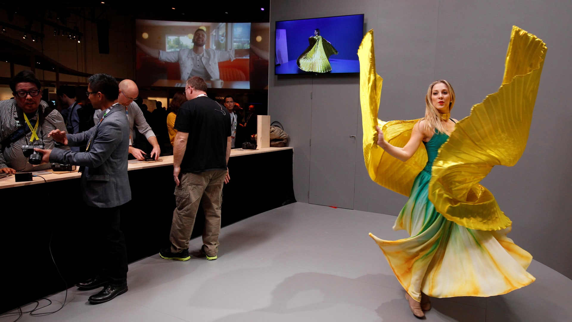 A dancer performs for photographers during a Sony news conference at the 2017 CES in Las Vegas, Nevada.