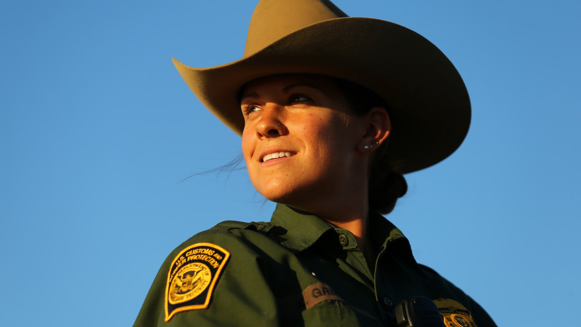 U.S. border patrol agent Katherine Griffith looks out from atop her horse while out on patrol along the U.S.-Mexico border near San Diego, California.