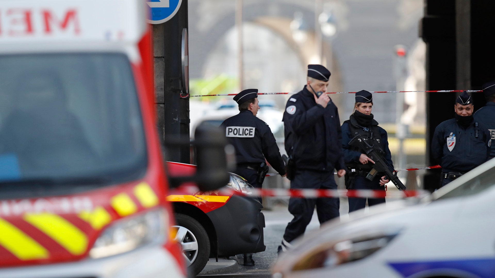 French police and emergency services are seen at the site near the Louvre Pyramid in Paris, France, February 3, 2017.