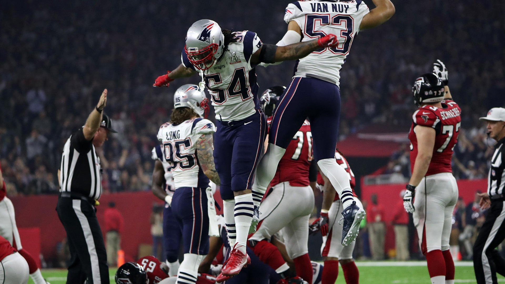 New England Patriots' Dont'a Hightower (L) and Kyle Van Noy celebrate after New England recovered the ball during the fourth quarter against the Atlanta Falcons at Super Bowl LI in Houston, Texas.