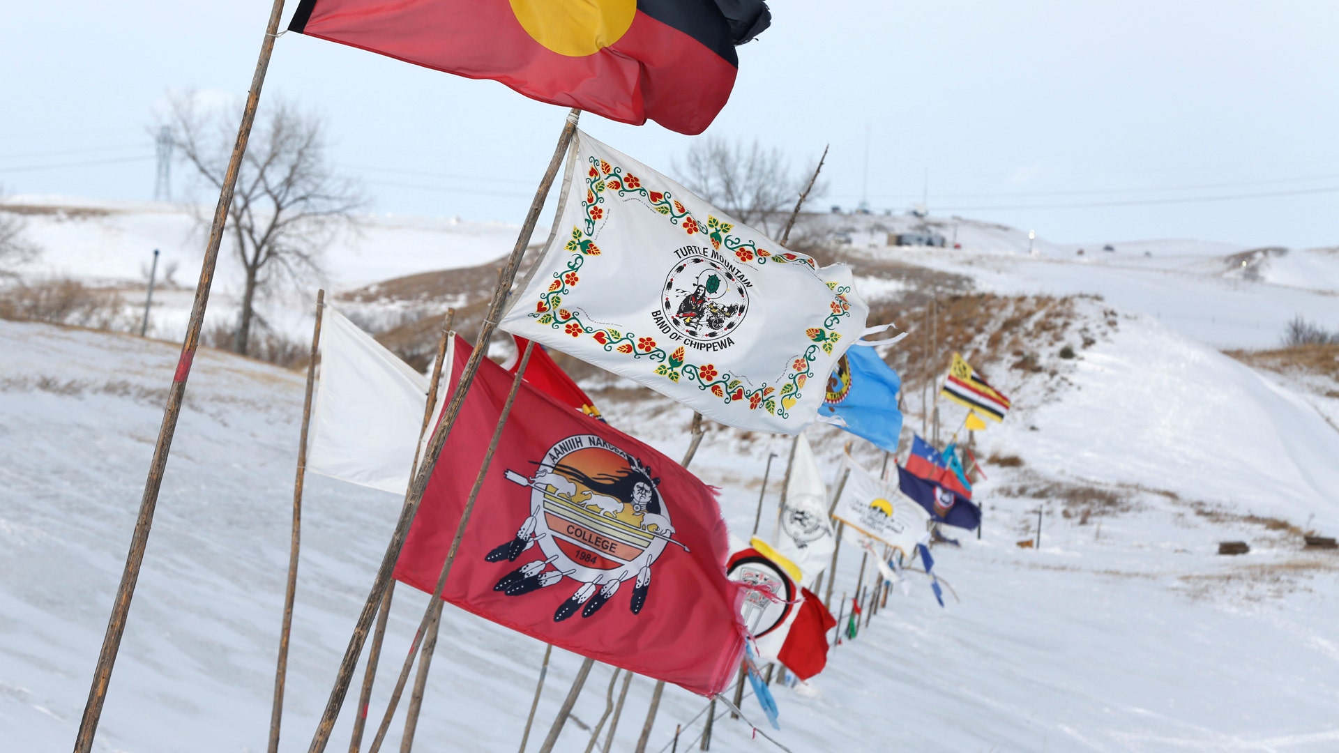 Tribal flags catch the wind in the opposition camp. 