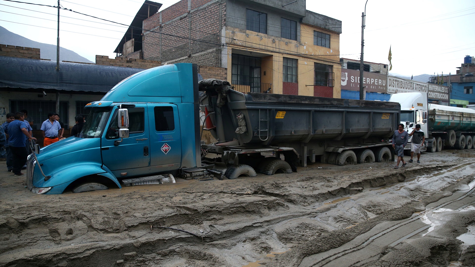 A truck is seen at the Central highway after a landslide and flood in Chosica, east of Lima.