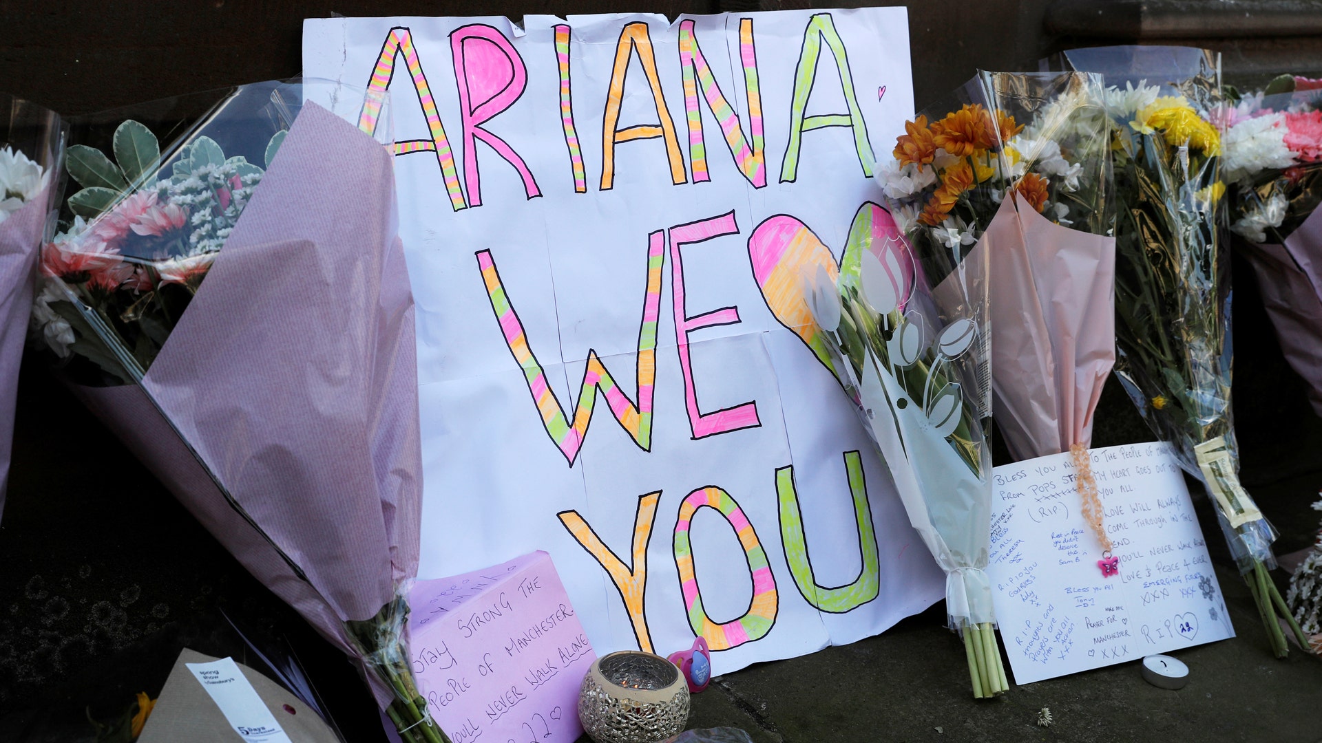 Flowers and messages for the victims of the Manchester Arena attack are seen in central Manchester