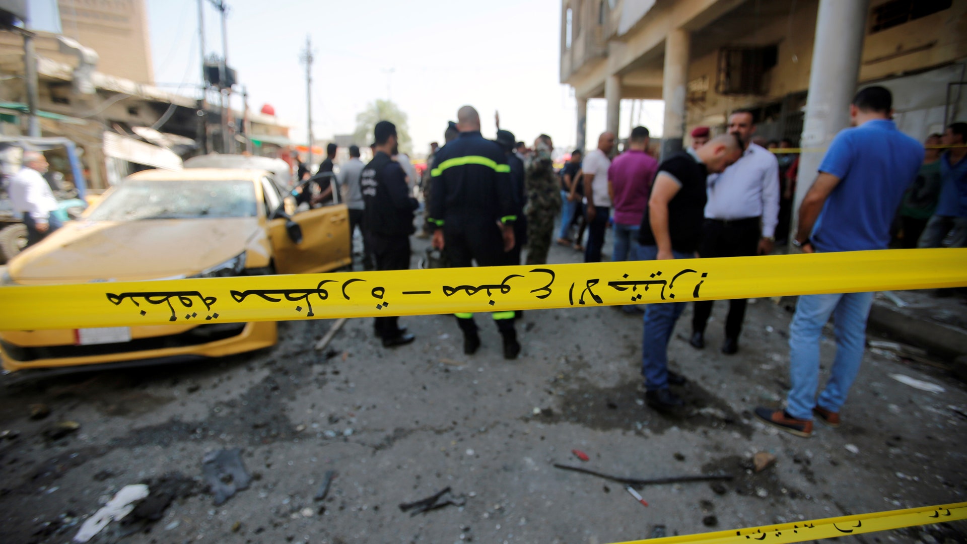 Police tape cordon is seen at the site of a car bomb attack in Baghdad