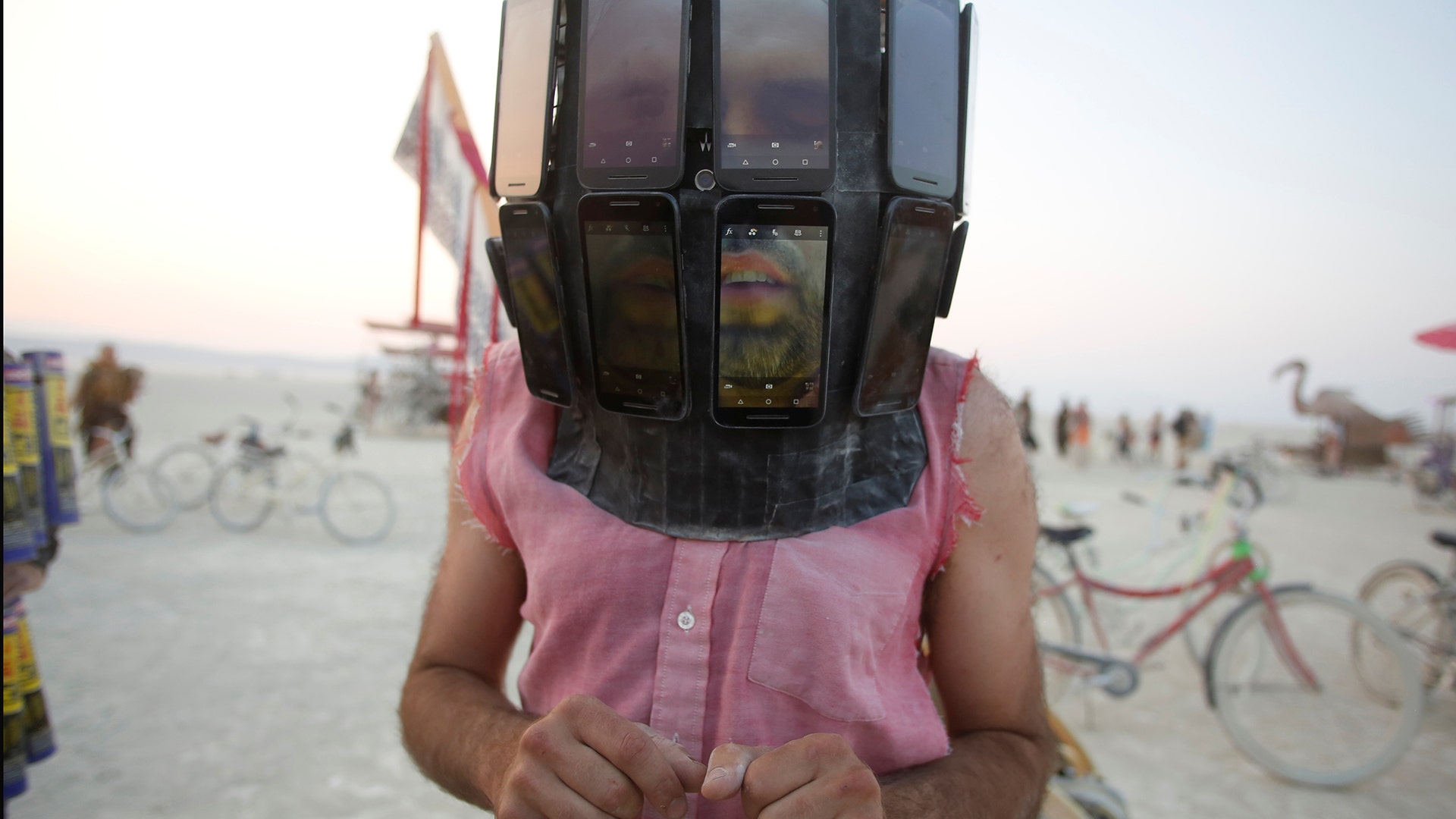 Derek Schoonmaker wears a helmet made of android phones at the annual Burning Man arts and music festival in Nevada, August 31