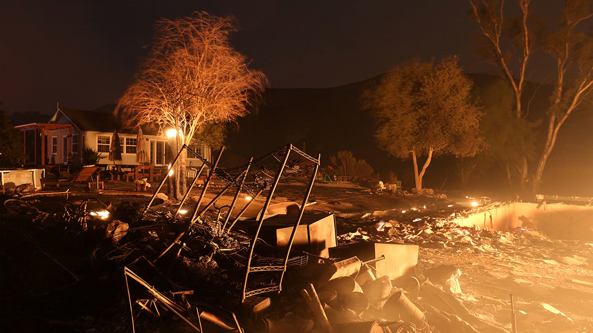 Property burns at night as strong winds push the Thomas Fire across thousands of acres near Santa Paula, California