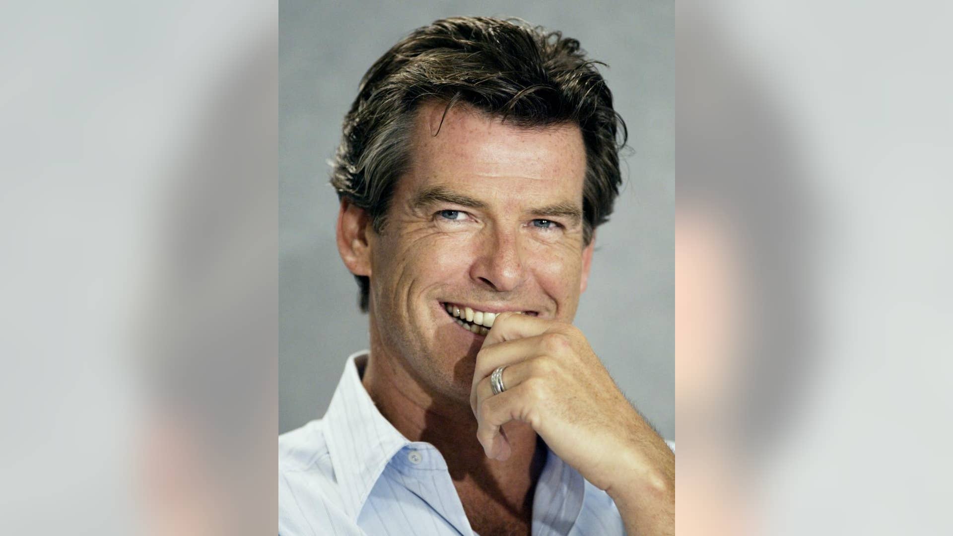 Smiling at the 27th Toronto International Film Festival September 9, 2002.