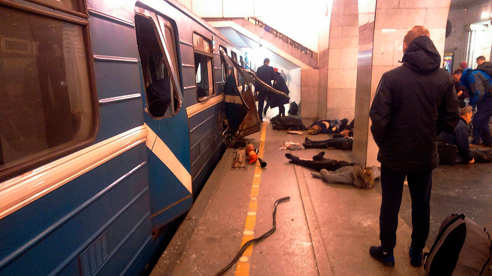 Blast victims lie near a subway train hit by a explosion at the Tekhnologichesky Institut subway station