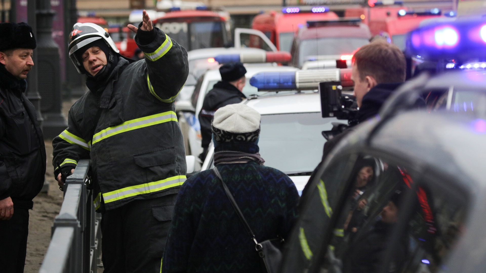 Emergency services direct pedestrians outside Sennaya Ploshchad metro station