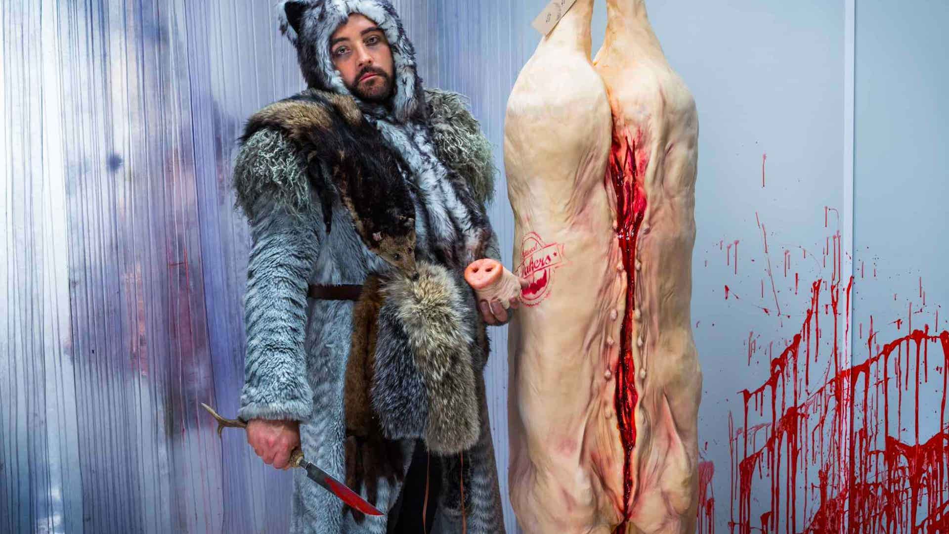 The Big Bad Wolf butchers his piggy prize.