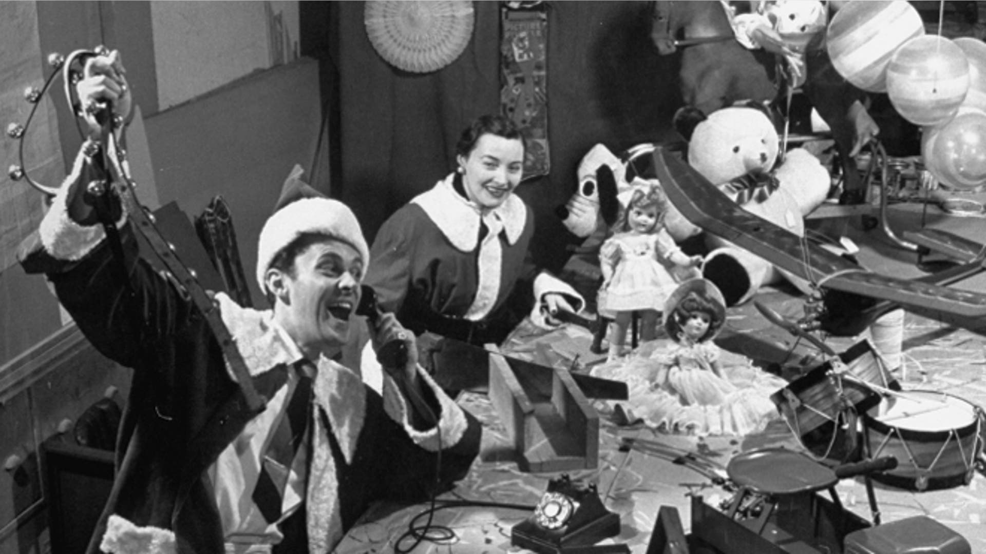 Kids on phone with Santa, 1947