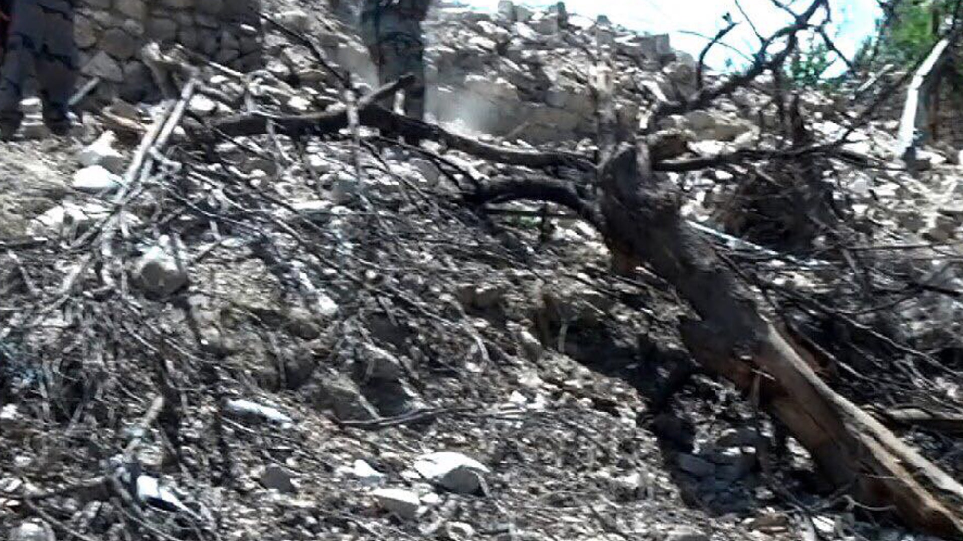 MOAB damage to the side of a mountain