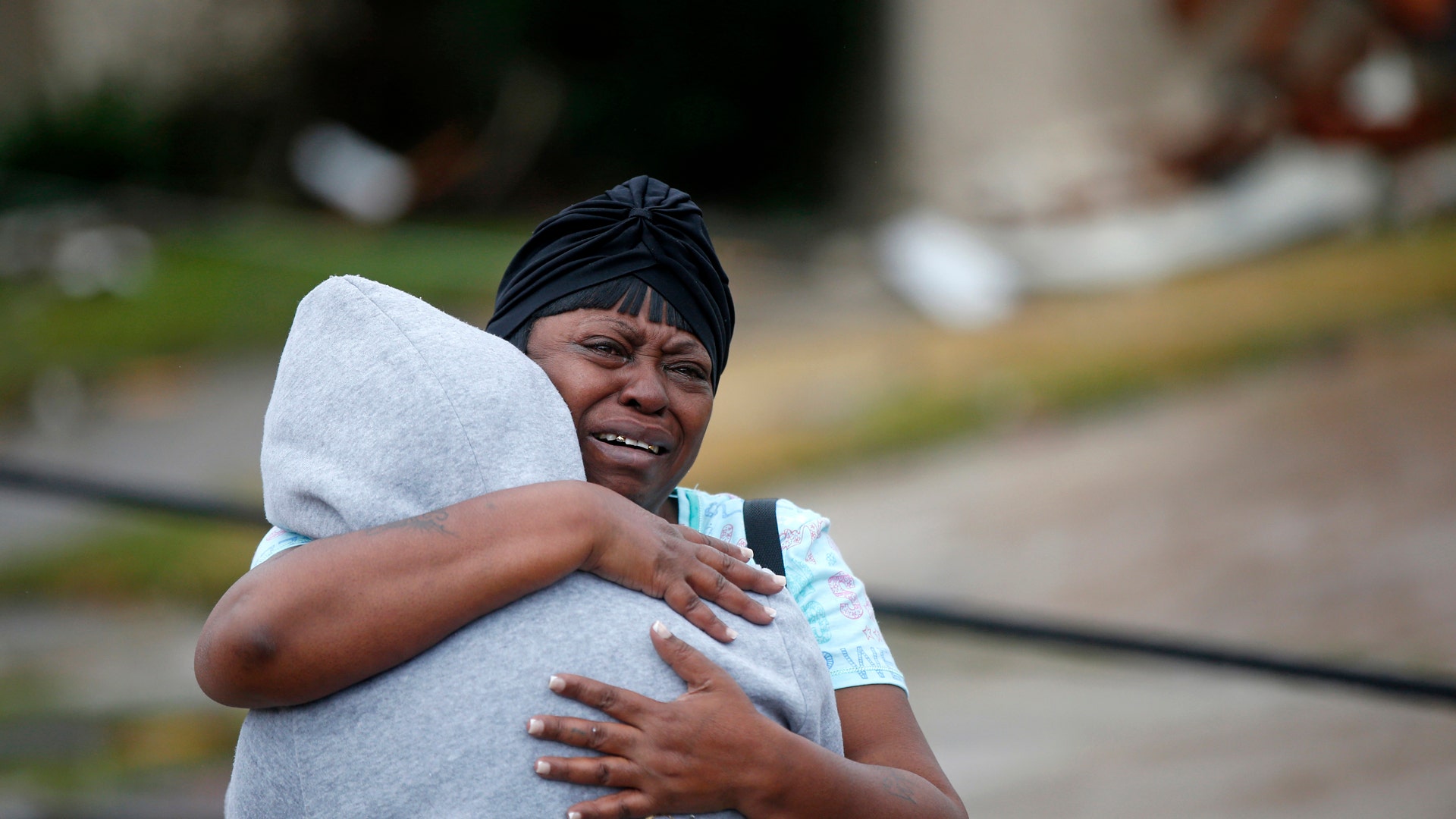 Lisa Carruth hugs her granddaughter Juayonna Carruth after a tornado tore through the eastern part of New Orleans.