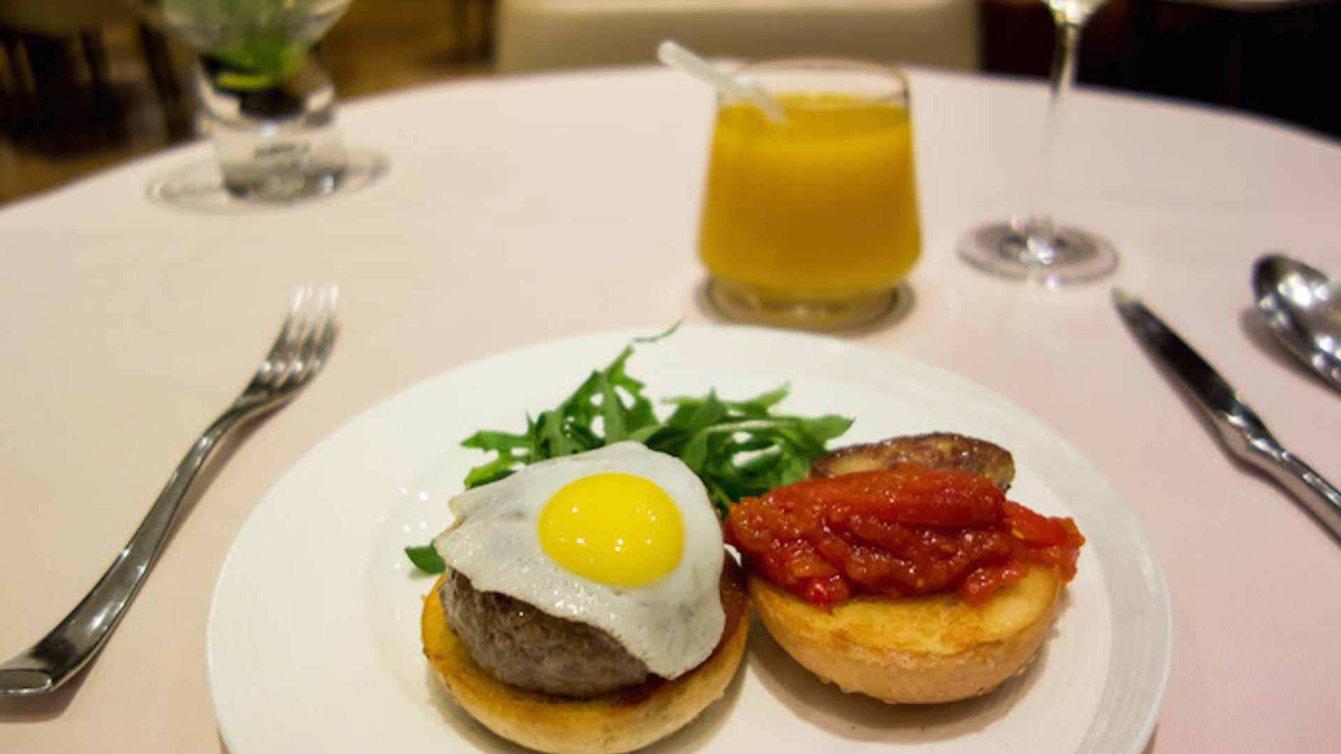 Burger with foie gras, rocket leaf and fried quail egg in The Private Room