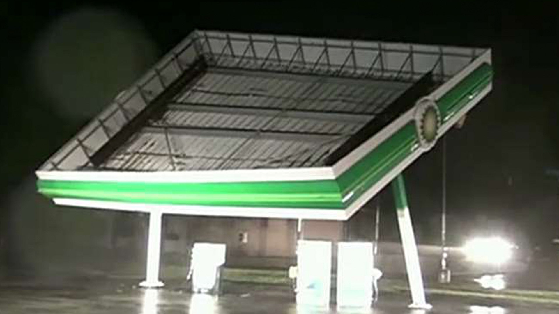 Part of a gas station blows over in the winds of Hurricane Florence in Topsail Beach, North Carolina, Friday