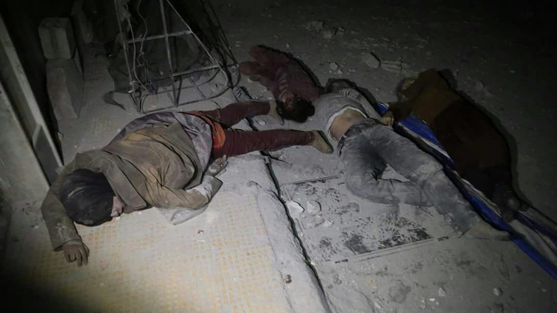 Victims of an alleged chemical weapons attack collapsed on the floor of a building in the rebel-held town of Douma, near Damascus, Syria.