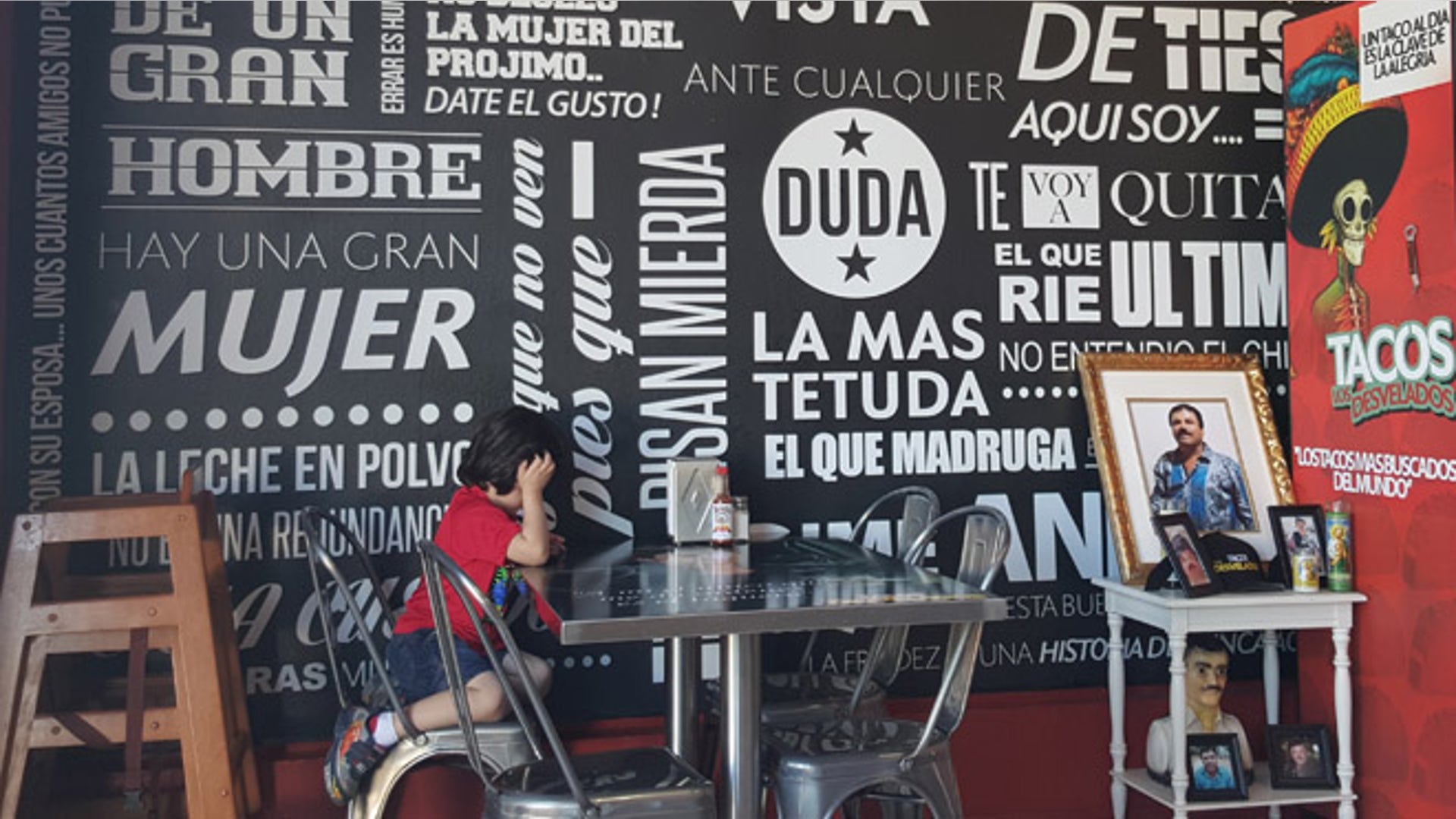 taquería wall and chapo altar.jpg